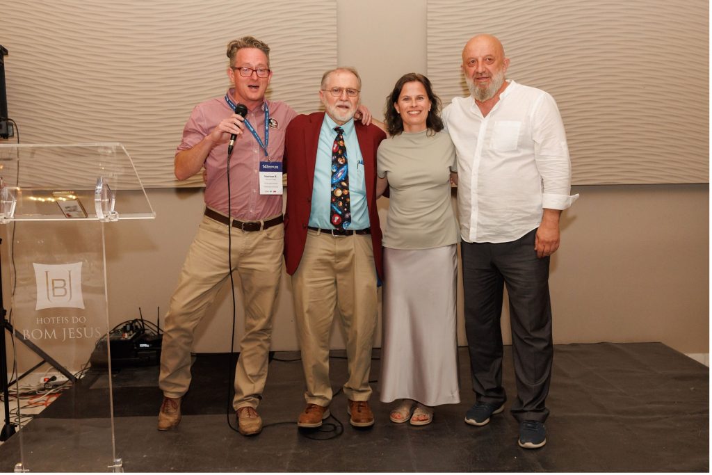 Harrison Pugh, Ray Fisk, Kristina Heinonen, and Driton Sahiti celebrating the announcement of Tirana as the host of the 2028 SERVSIG Conference.